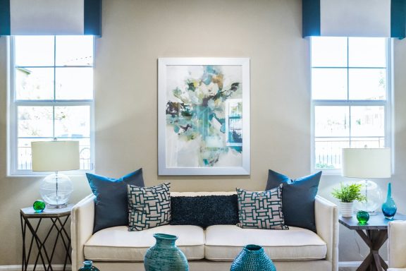 Sofa with 2  large windows with light coming in